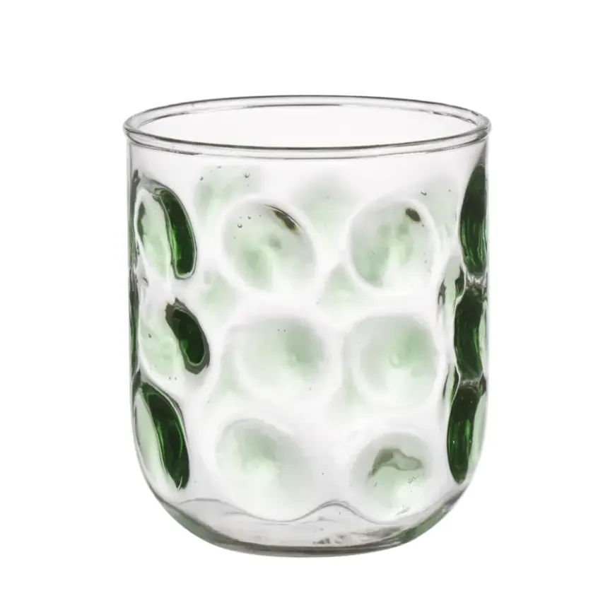 Glas met groene stippen