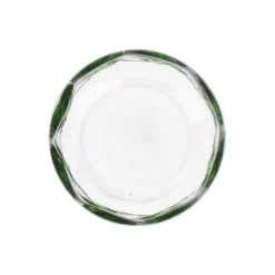 Glas met groene stippen
