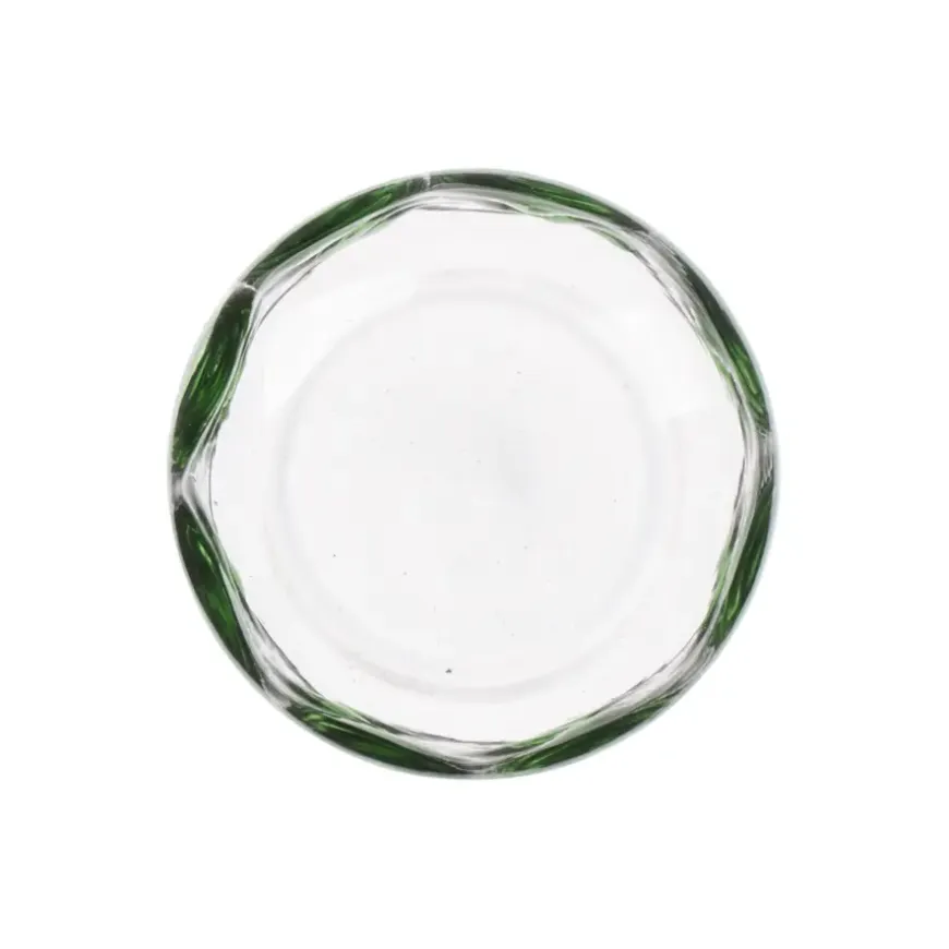 Glas met groene stippen